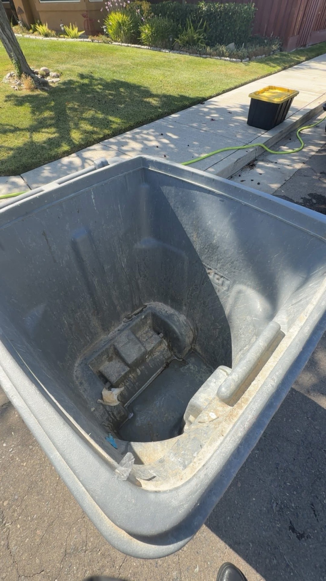 Trash bin before pressure washing
