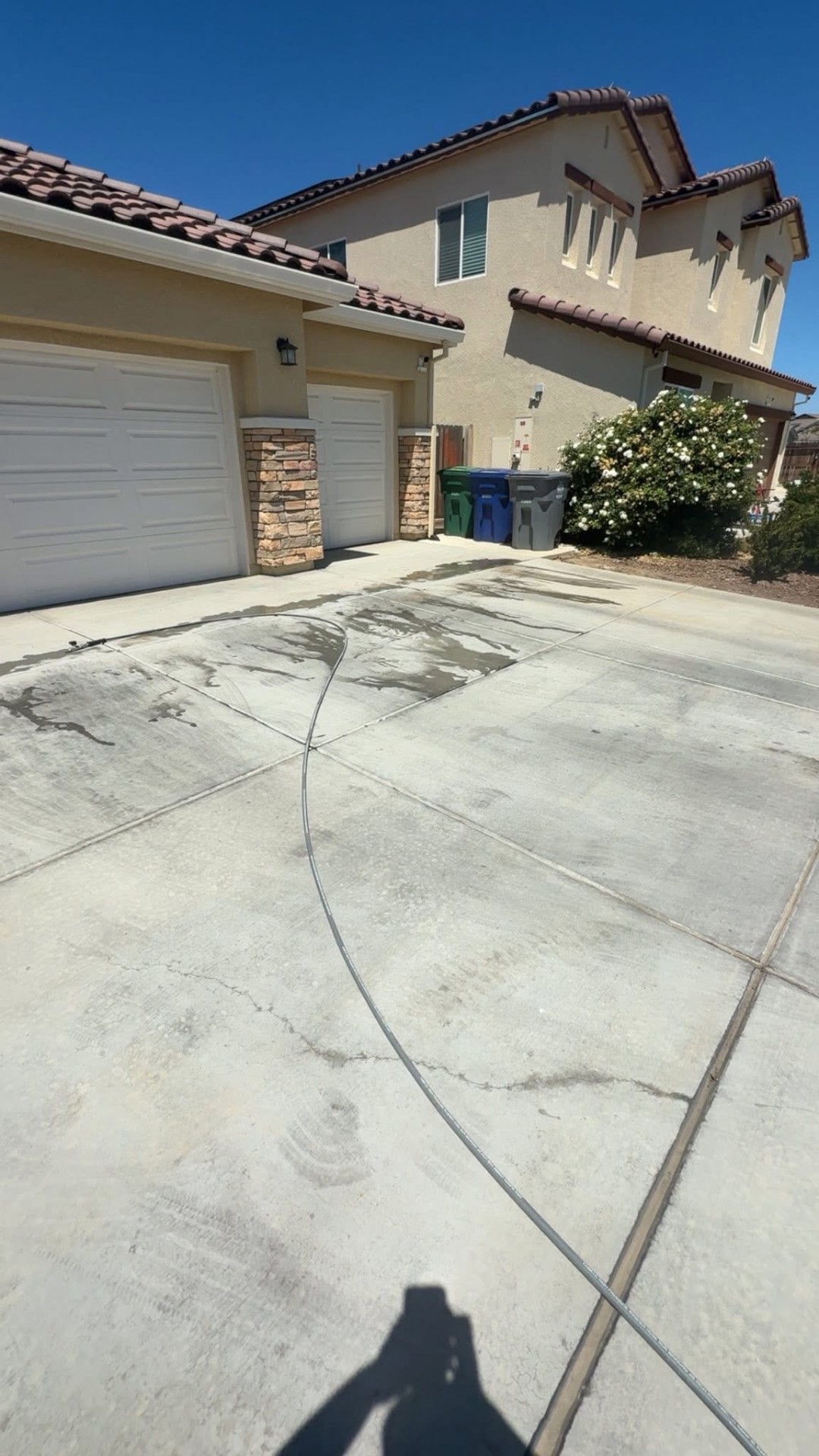 Driveway before pressure washing